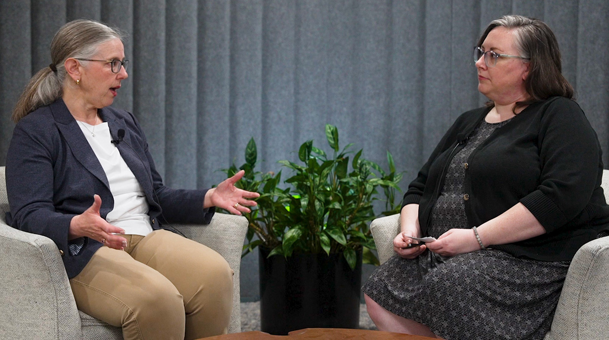 Photo of Marla Bump and Erin Deel discussing WEP/GPO issues.